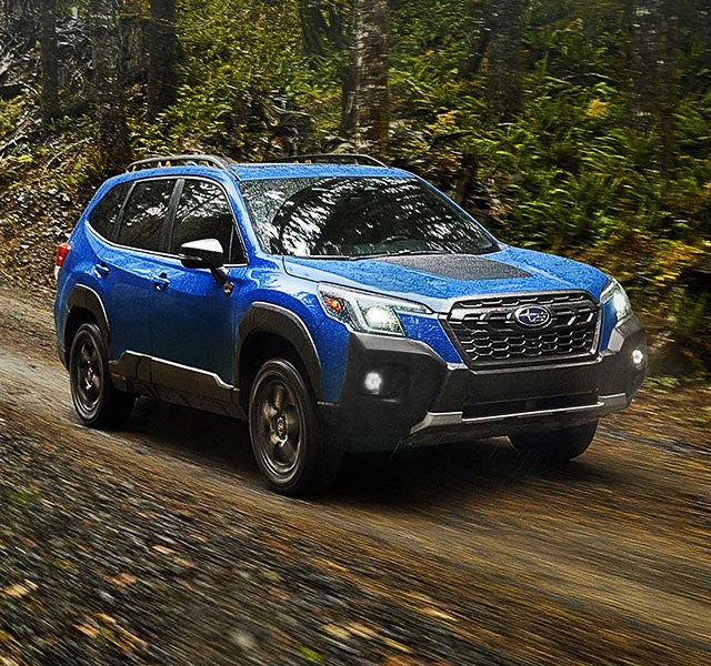 A 2022 Forester driving on a highway. | Paul Moak Subaru in Jackson MS