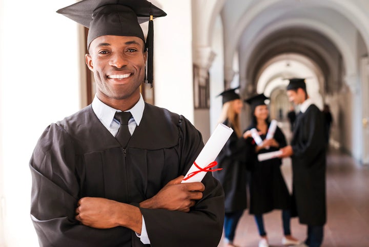 college graduate holding his diploma | Paul Moak Subaru in Jackson MS