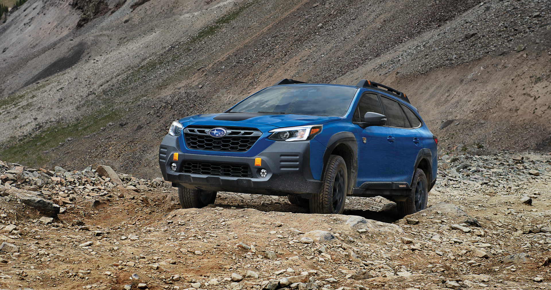 A 2023 Outback Wilderness driving on a trail in the mountains. | Paul Moak Subaru in Jackson MS